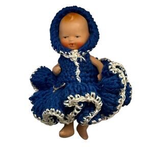 Baby doll vintage celluloid in crocheted outfit